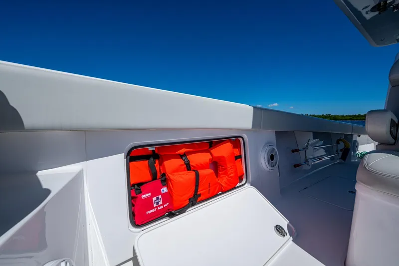 Slide: The Image of 2022 Jupiter 32 boat interior with life jackets and first aid kit storage. - 20