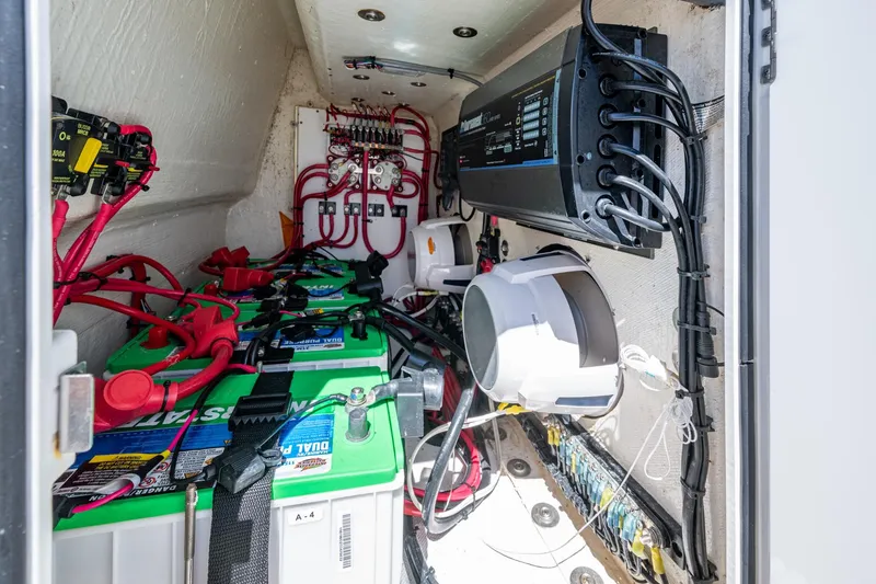 Slide: The Image of Electrical system of a 2022 Jupiter 32 boat with batteries and wiring. - 23