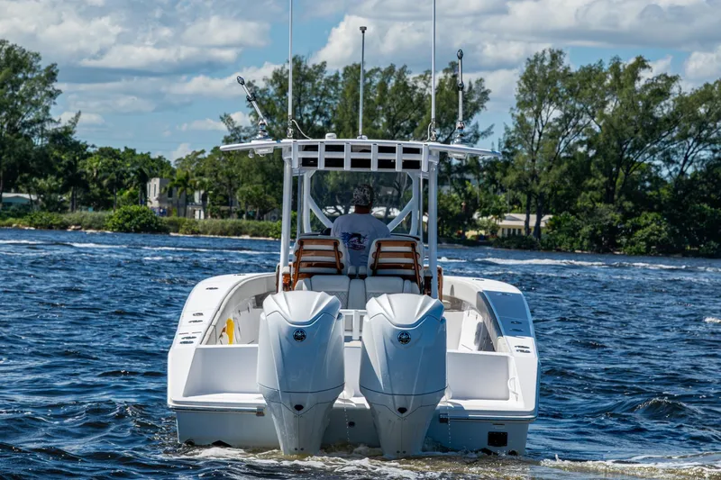 Slide: The Image of 2022 Jupiter 32 boat cruising on a sunny day with twin engines. - 25