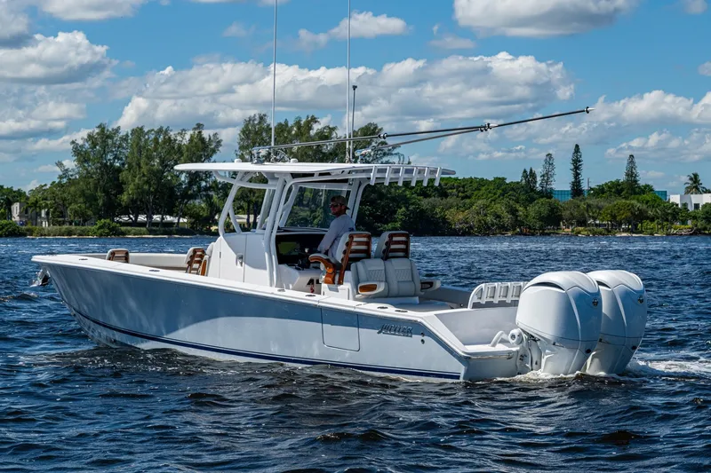 Slide: The Image of 2022 Jupiter 32 boat cruising on a sunny day with twin engines. - 26