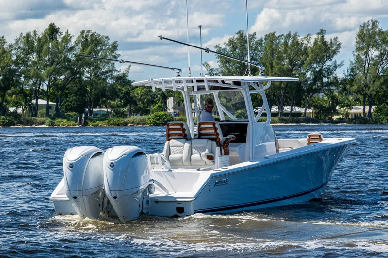 Slide: The Image of 2022 Jupiter 32 boat cruising on a sunny day with twin engines. - 4