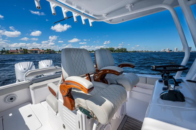 Slide: The Image of 2022 Jupiter 32 boat interior with luxurious seating and ocean view. - 7