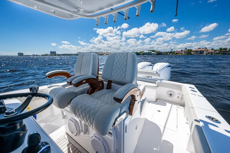 Slide: The Image of Luxurious 2022 Jupiter 32 boat interior with plush seating on a sunny day. - 8