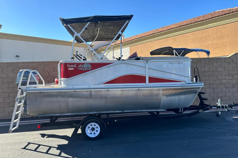 The Image of 2020 G3 SunCatcher V16 Cruise pontoon boat on trailer, parked outdoors. - 0