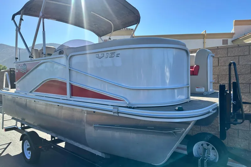 Slide: The Image of 2020 G3 SunCatcher V16 Cruise pontoon boat on trailer, sunny day. - 1