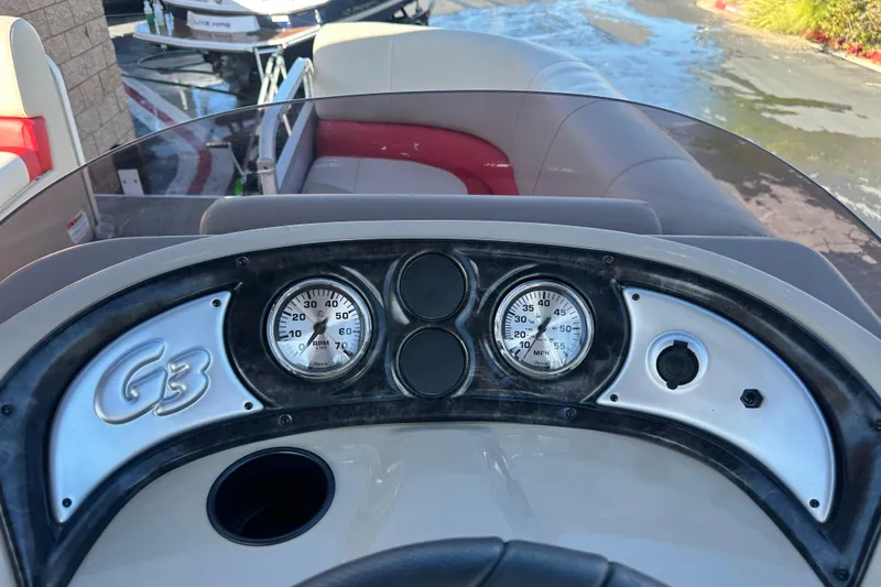 Slide: The Image of Dashboard of 2020 G3 SunCatcher V16 Cruise boat with gauges and controls. - 12