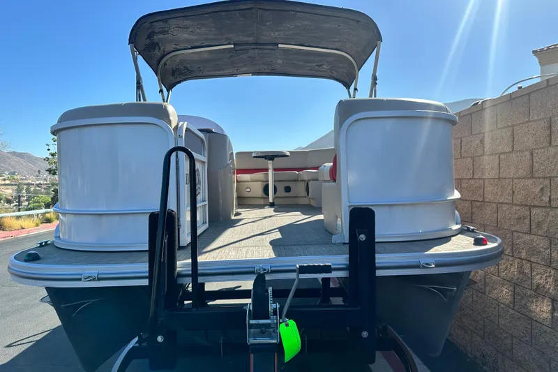 Slide: The Image of 2020 G3 SunCatcher V16 Cruise pontoon boat on trailer, sunny day. - 2