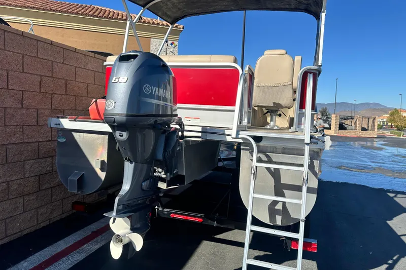 Slide: The Image of 2020 G3 SunCatcher V16 Cruise pontoon boat with Yamaha 60 engine, parked outdoors. - 3