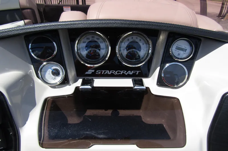 Slide: The Image of Dashboard of a 2021 Starcraft SLS 1 boat with gauges and controls. - 19