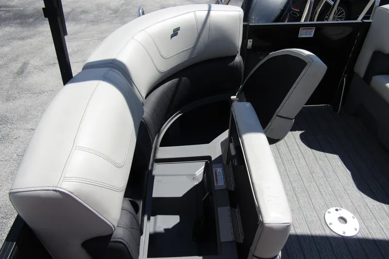 Slide: The Image of 2021 Starcraft SLS 1 boat interior with gray seating and storage compartments. - 23
