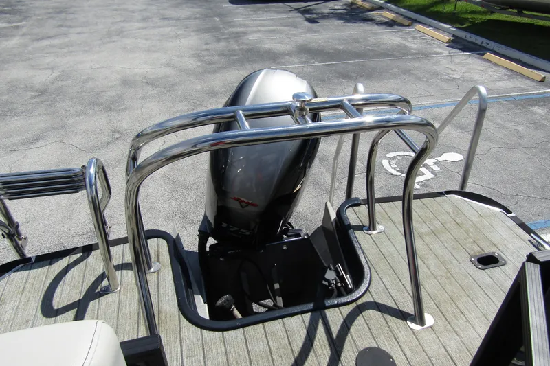 Slide: The Image of 2021 Starcraft SLS 1 boat with outboard motor and stainless steel railing. - 26