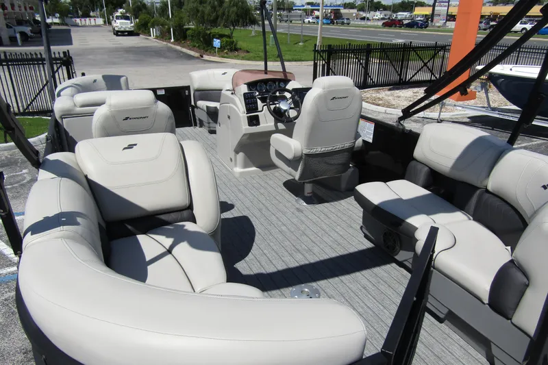 Slide: The Image of 2021 Starcraft SLS 1 pontoon boat with spacious seating and modern helm. - 27