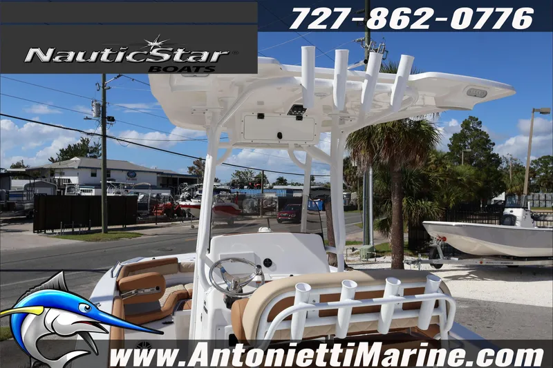 Slide: The Image of 2025 NauticStar 231 Hybrid boat displayed at Antonietti Marine dealership. - 11
