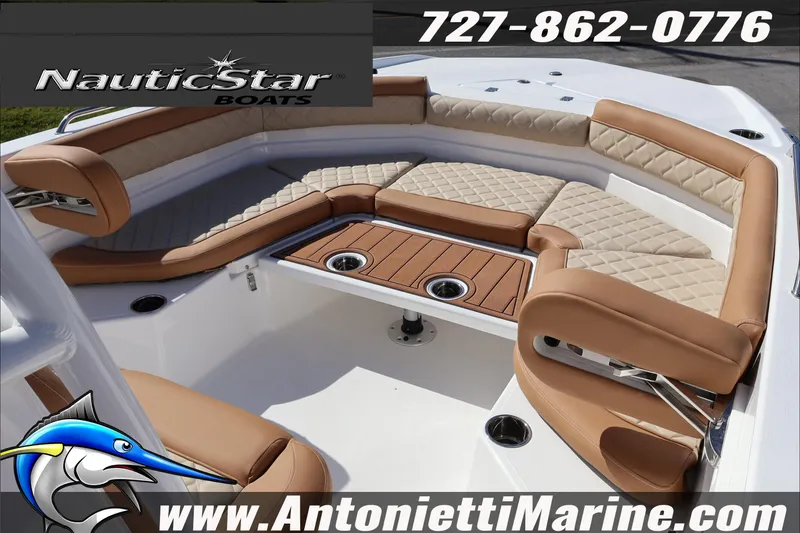 Slide: The Image of 2025 NauticStar 231 Hybrid boat interior with tan seating and wood accents. - 19