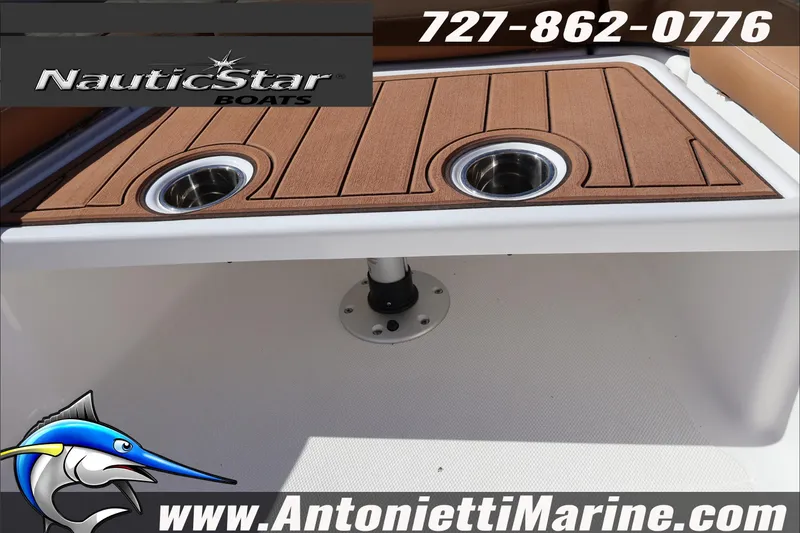 Slide: The Image of 2025 NauticStar 231 Hybrid boat interior with cup holders, showcased by Antonietti Marine. - 20