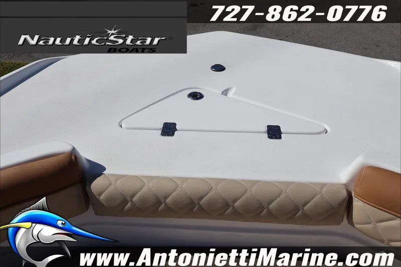 Slide: The Image of 2025 NauticStar 231 Hybrid boat deck with quilted seating, contact details, and logo. - 21