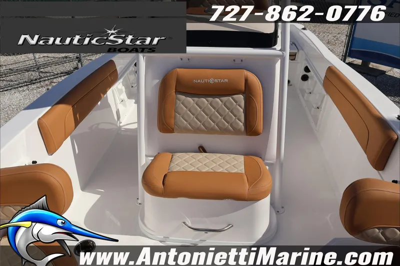 Slide: The Image of 2025 NauticStar 231 Hybrid boat interior with tan and white seating, Antonietti Marine branding. - 24