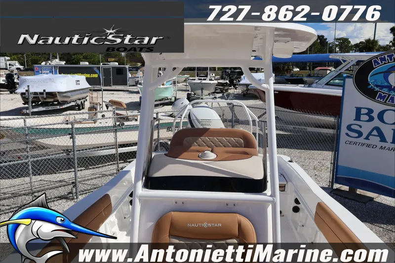 Slide: The Image of 2025 NauticStar 231 Hybrid boat displayed at Antonietti Marine dealership. - 25