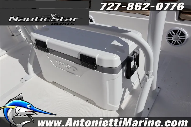 Slide: The Image of 2025 NauticStar 231 Hybrid boat interior with Igloo cooler and marine speaker. - 30