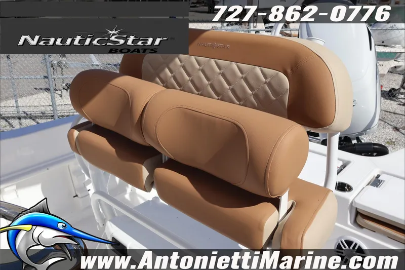 Slide: The Image of 2025 NauticStar 231 Hybrid boat seats with tan upholstery, displayed at Antonietti Marine. - 31