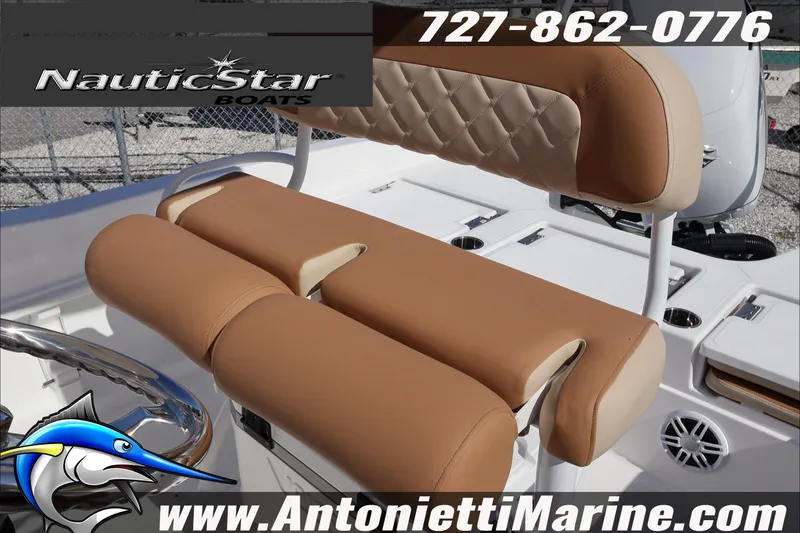 Slide: The Image of 2025 NauticStar 231 Hybrid boat seating with tan upholstery, showcased by Antonietti Marine. - 32