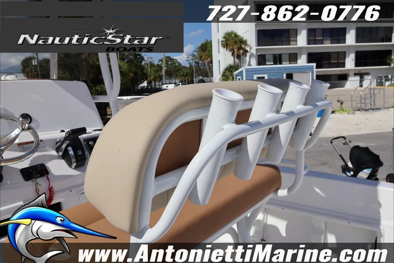 Slide: The Image of 2025 NauticStar 231 Hybrid boat interior with rod holders and seating, Antonietti Marine. - 33