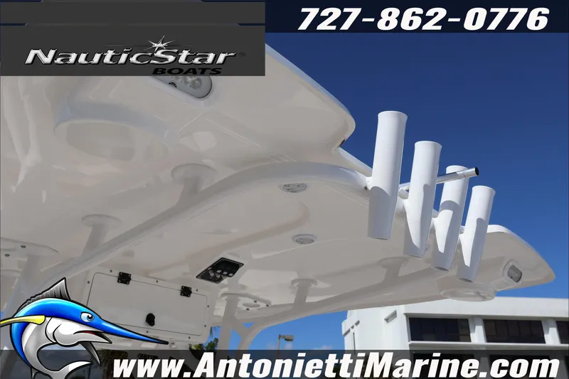 Slide: The Image of 2025 NauticStar 231 Hybrid boat with rod holders, showcased by Antonietti Marine. - 34