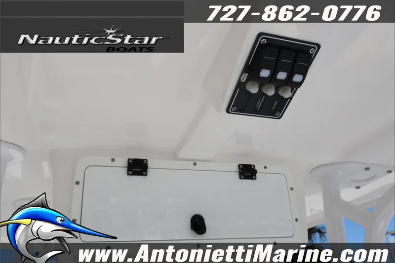 Slide: The Image of 2025 NauticStar 231 Hybrid boat control panel with switches and logo. - 35