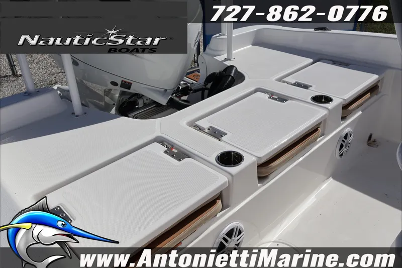 Slide: The Image of 2025 NauticStar 231 Hybrid boat interior with storage compartments and cup holders. - 36