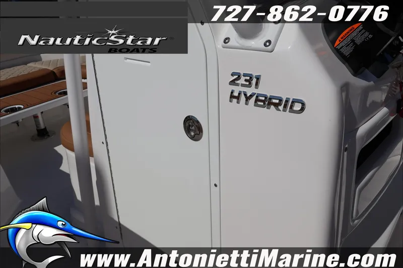 Slide: The Image of 2025 NauticStar 231 Hybrid boat, featuring sleek design and branding details. - 39