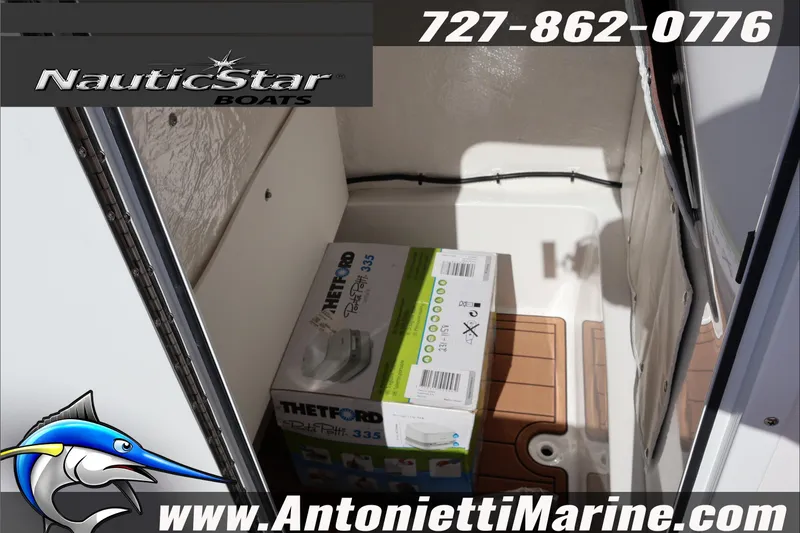 Slide: The Image of 2025 NauticStar 231 Hybrid boat interior with Thetford Porta Potti box. - 40