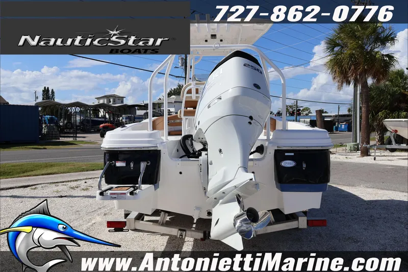 Slide: The Image of 2025 NauticStar 231 Hybrid boat with outboard motor at Antonietti Marine dealership. - 8