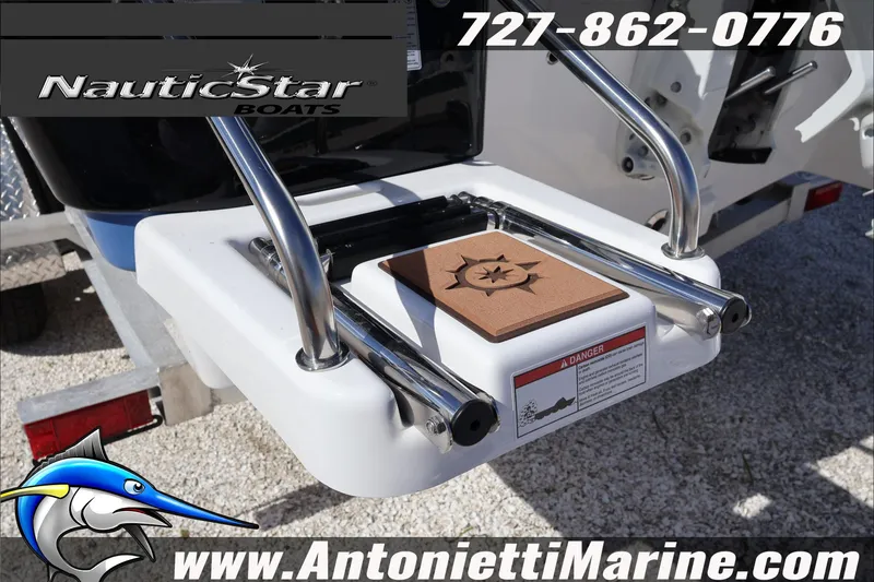 Slide: The Image of 2025 NauticStar 231 Hybrid boat with stainless steel ladder and branding details. - 9