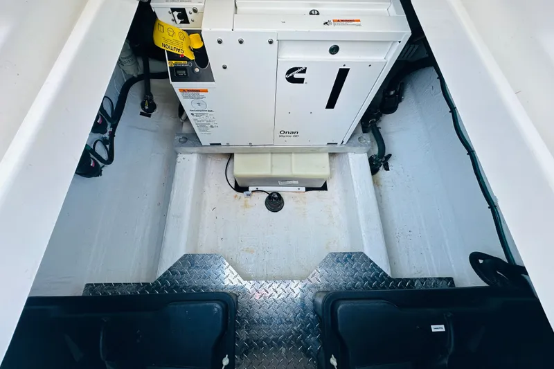 Slide: The Image of 2024 Back Cove 34O boat with striped seating and Mercury outboard engines. - 17