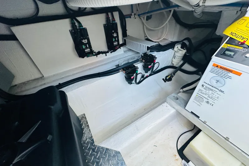 Slide: The Image of 2024 Back Cove 34O boat docked, featuring a sleek design and spacious deck. - 19