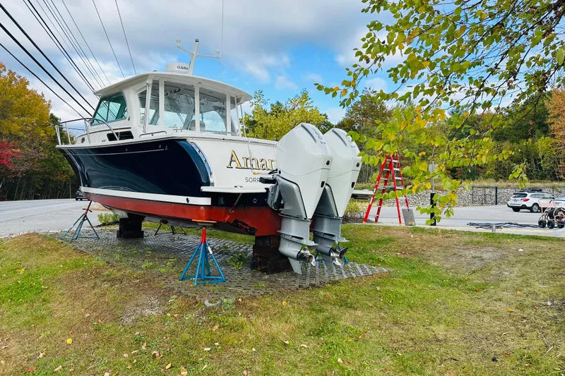 Slide: The Image of 2024 Back Cove 34O boat anchor system with chain and cleat on deck. - 26