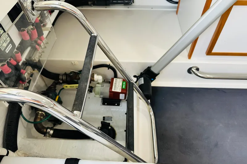 Slide: The Image of 2024 Back Cove 34O boat on display, surrounded by autumn trees and parked cars. - 33