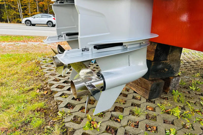 Slide: The Image of 2024 Back Cove 34O boat propellers on display outdoors. - 36