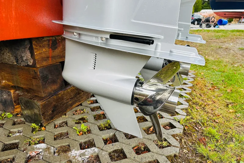 Slide: The Image of 2024 Back Cove 34O boat propeller detail on display outdoors. - 37