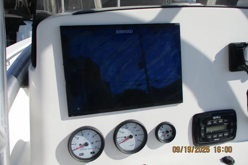Slide: The Image of Control panel of 2018 NauticStar 22 XS Offshore boat with Simrad display. - 11