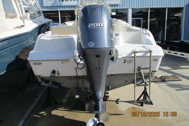 Slide: The Image of 2018 NauticStar 22 XS Offshore boat with Yamaha 200 engine, displayed outdoors. - 16