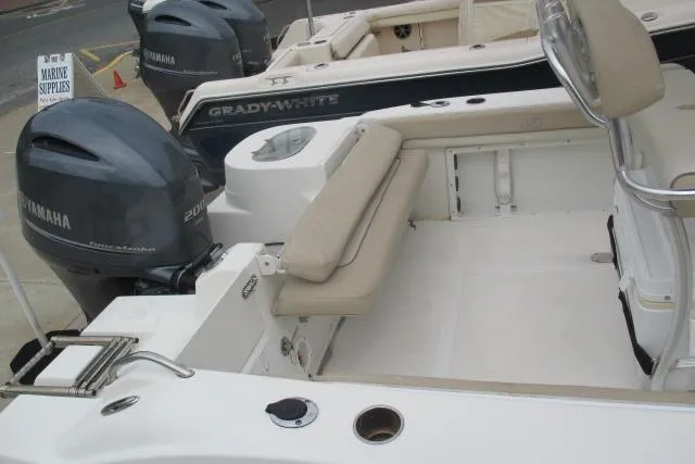 Slide: The Image of 2018 NauticStar 22 XS Offshore boat with Yamaha engines, featuring spacious seating and marine supplies. - 3
