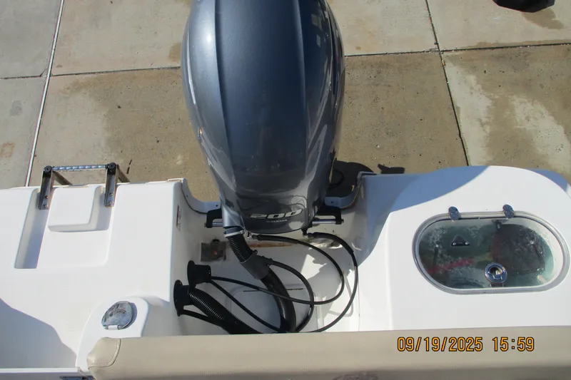 Slide: The Image of 2018 NauticStar 22 XS Offshore boat engine and deck view. - 6