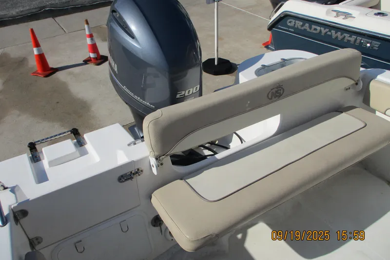 Slide: The Image of 2018 NauticStar 22 XS Offshore boat with Yamaha 200 engine, docked near traffic cones. - 8