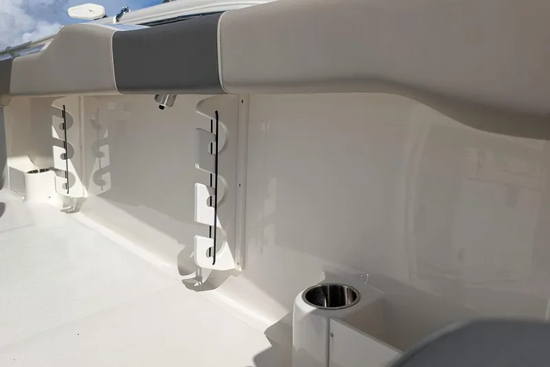 Slide: The Image of Interior view of 2025 Key West 263 FS boat, featuring rod holders and cup holder. - 10