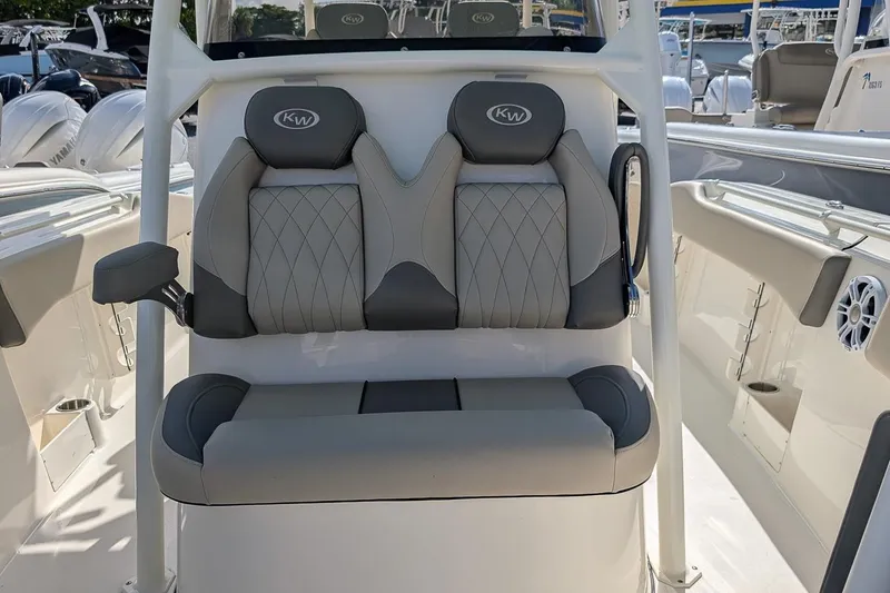 Slide: The Image of 2025 Key West 263 FS boat interior seating with gray upholstery and armrest. - 14
