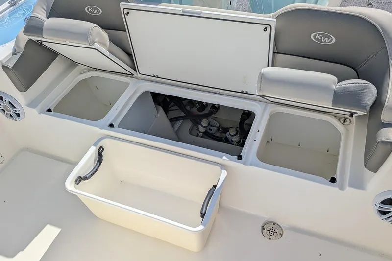 Slide: The Image of 2025 Key West 263 FS boat storage compartments and seating area. - 6