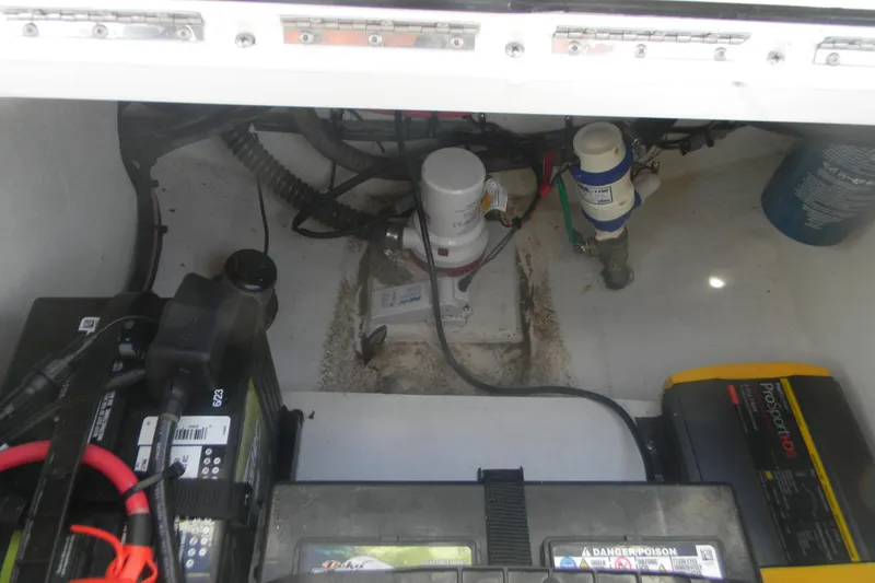 Slide: The Image of 2024 Parker 2320 SL Sport Cabin boat interior showing battery and electrical components. - 7