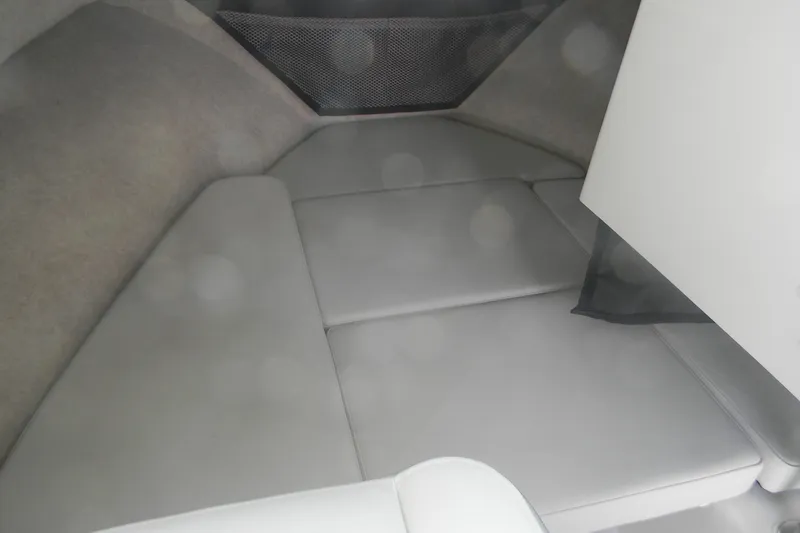 Slide: The Image of 2024 Parker 2320 SL Sport Cabin interior with cushioned seating and storage net. - 8