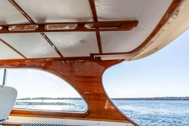 Slide: The Image of Interior view of 2007 Hinckley Talaria 40 yacht with wooden details and ocean backdrop. - 22